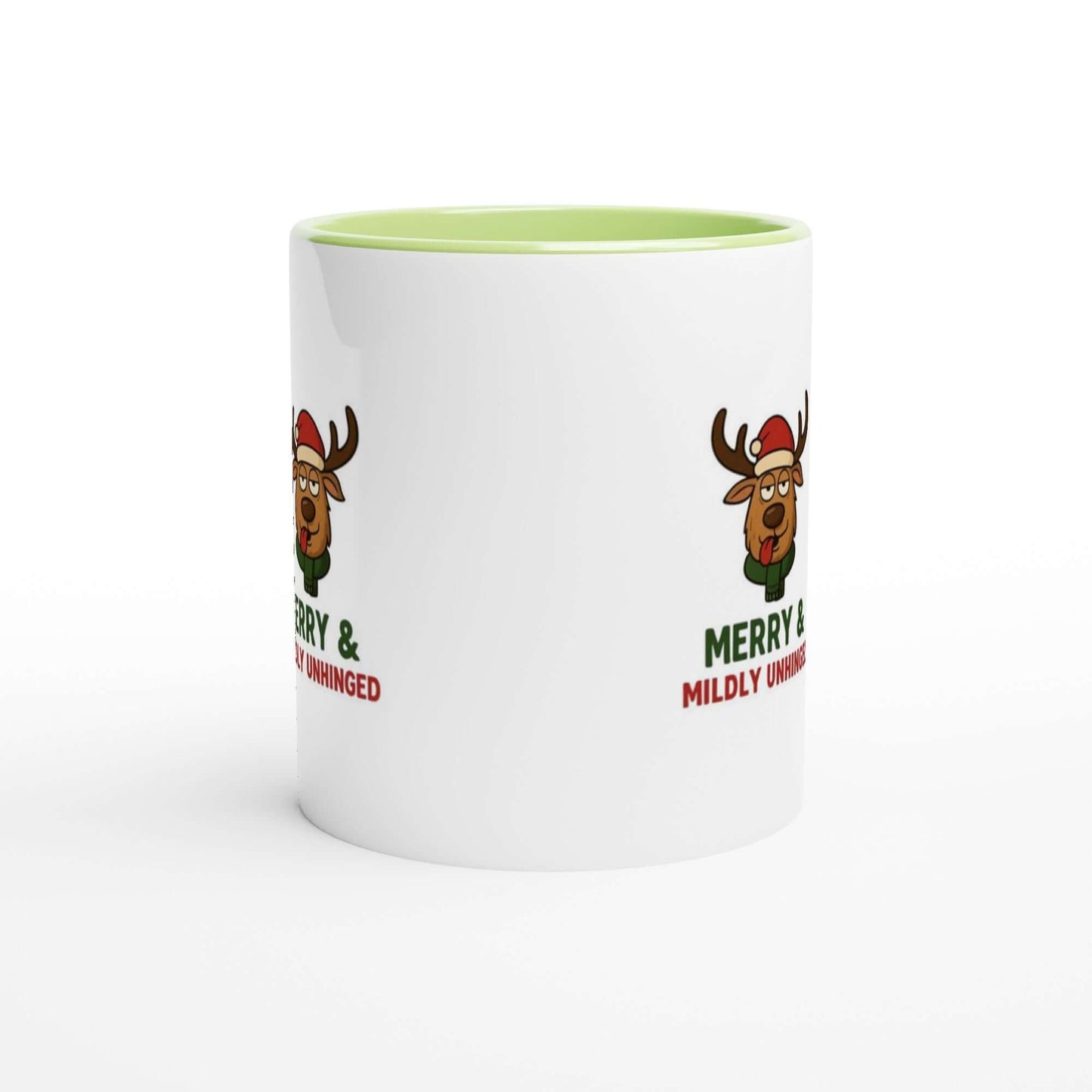 White mug with green interior and reindeer design