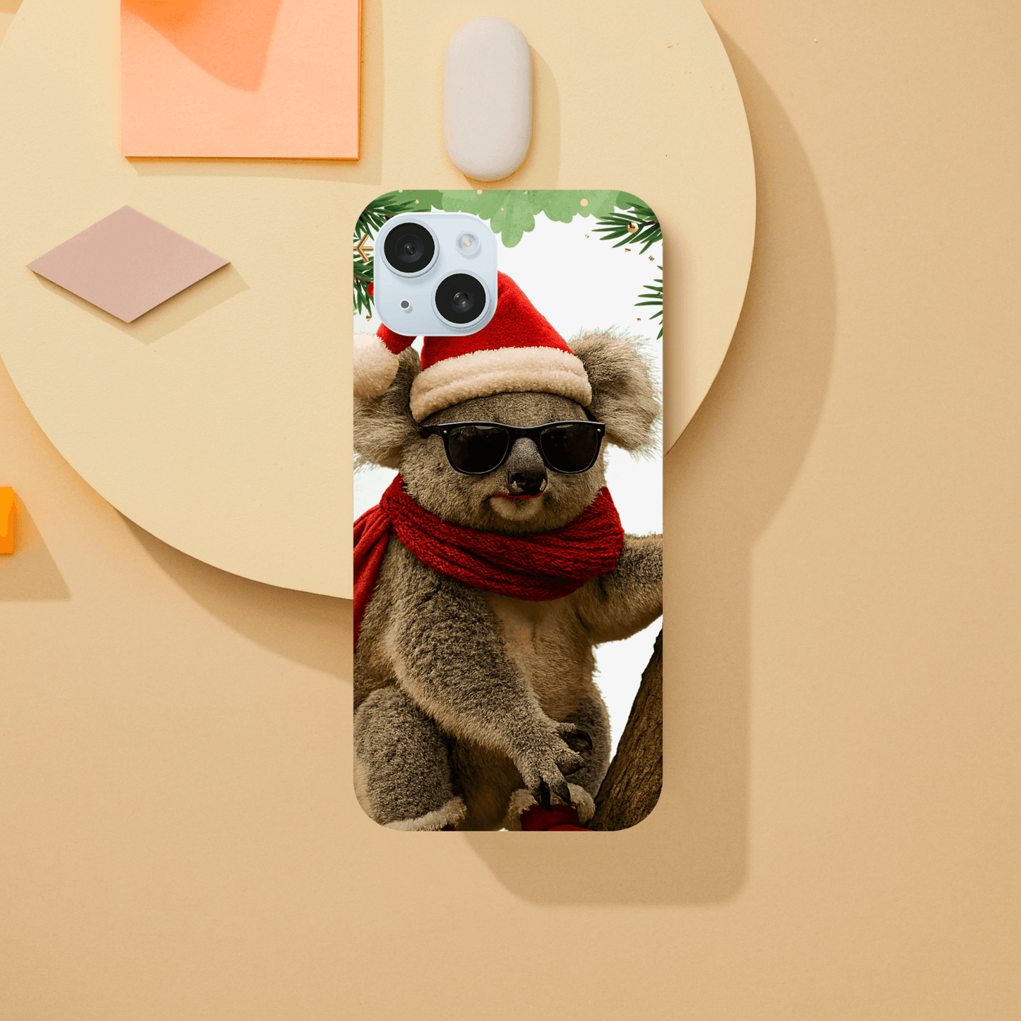 Phone case with a design of a koala wearing sunglasses and a Santa hat