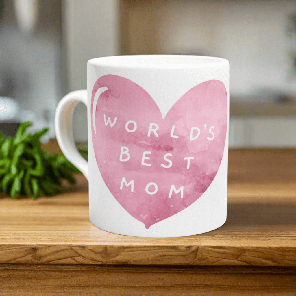 Mug with 'World's Best Mom' text on a pink heart design