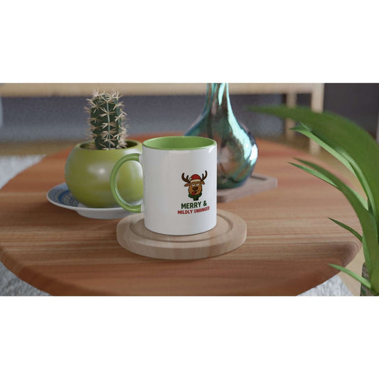 White mug with green handle