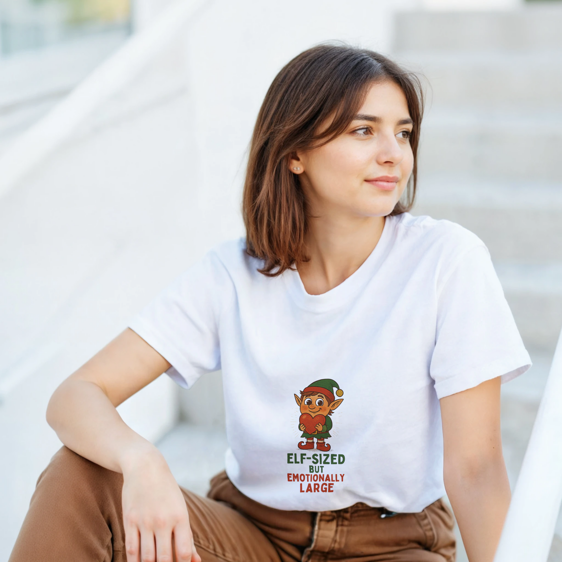 a white t-shirt with an elf graphic and text