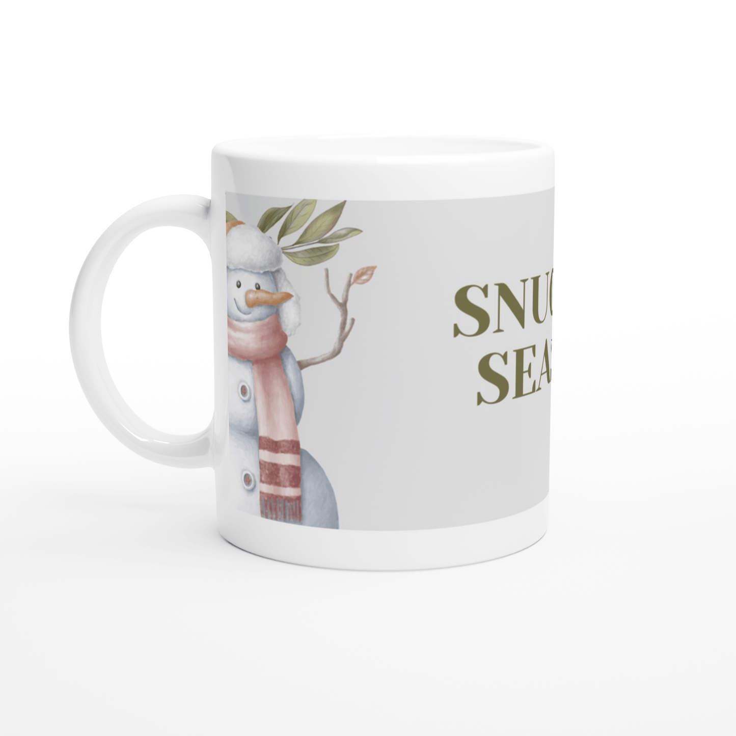 White mug with a snowman design and 'Snuggle Season' text 