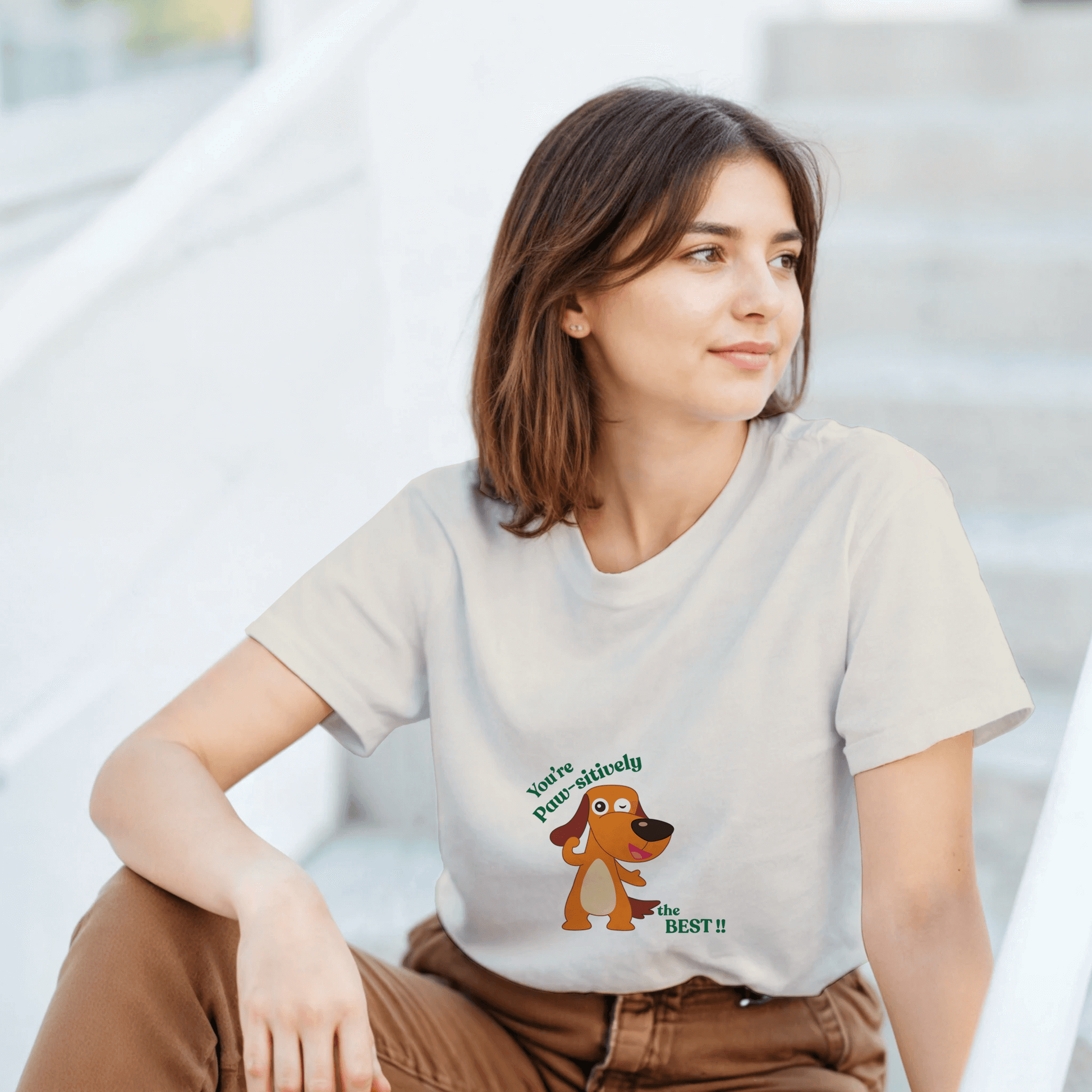 a white t-shirt with a cartoon dog graphic and text.