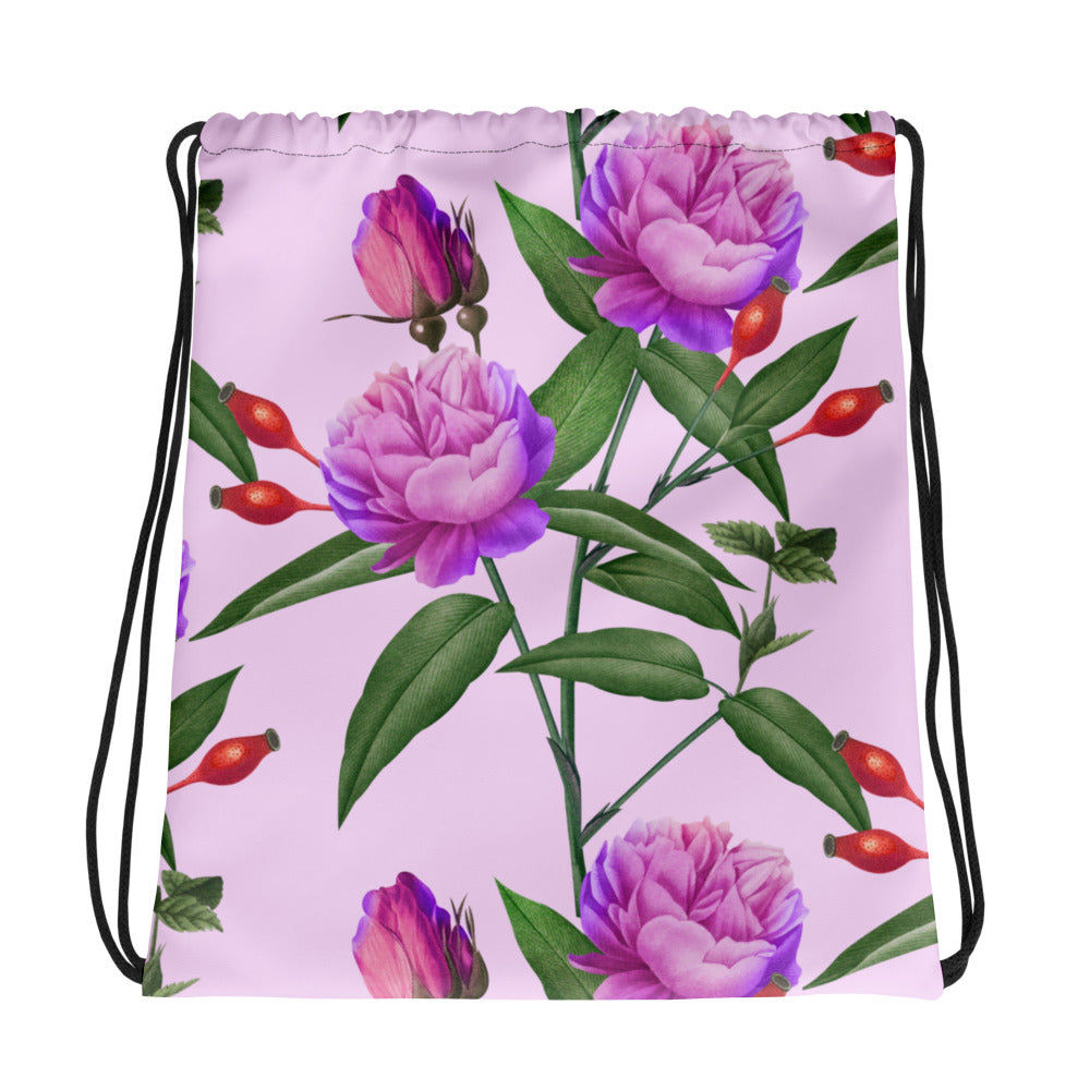 Drawstring bag with purple floral design on a pink background
