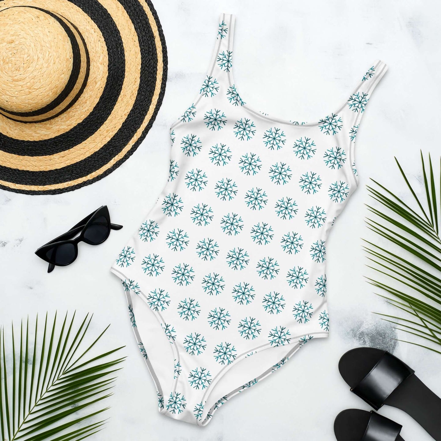 White swimsuit with blue snowflake pattern