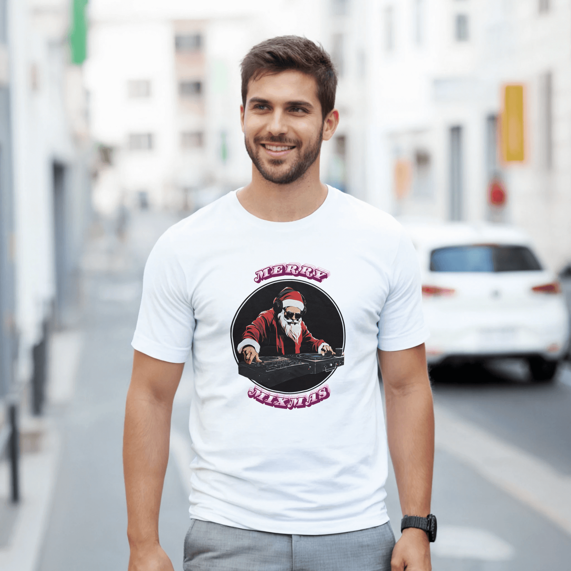 Man wearing a DJ Santa Merry Mixmas T-shirt on a city street, celebrating the festive season.