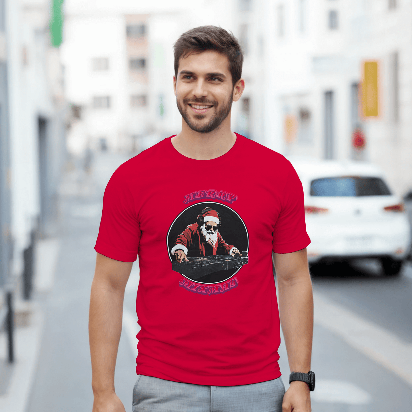 Man wearing a red T-shirt featuring DJ Santa Merry Mixmas design for a festive holiday look.