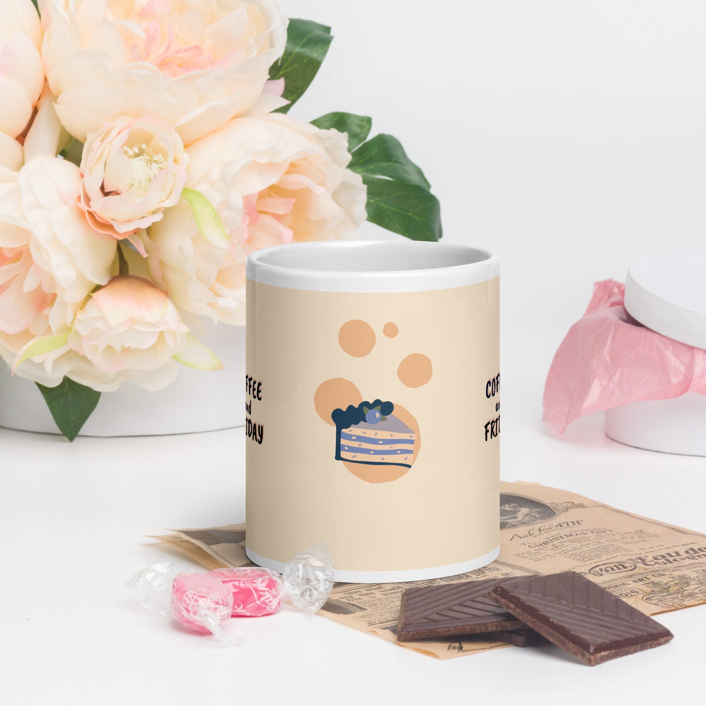 Beige mug with cake illustration and text